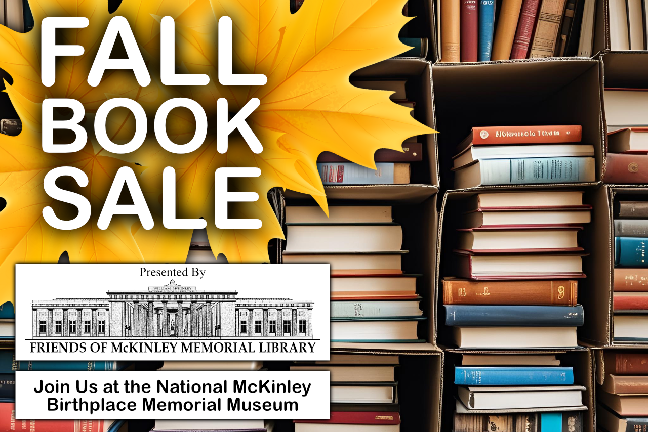Fall Book Sale large title over fall leaf with boxes of stacked books.
