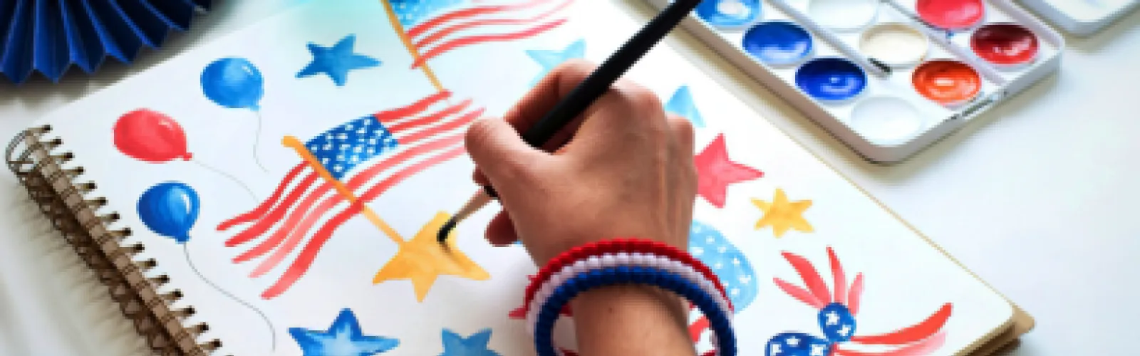 Patriotic Art being hand painted in an art book.