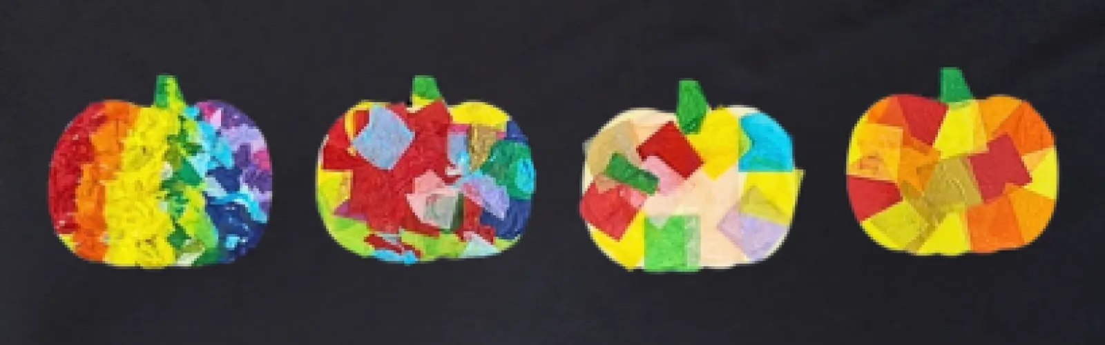 Four pumpkin-shaped tissue paper Fall ornaments displayed against a black background.